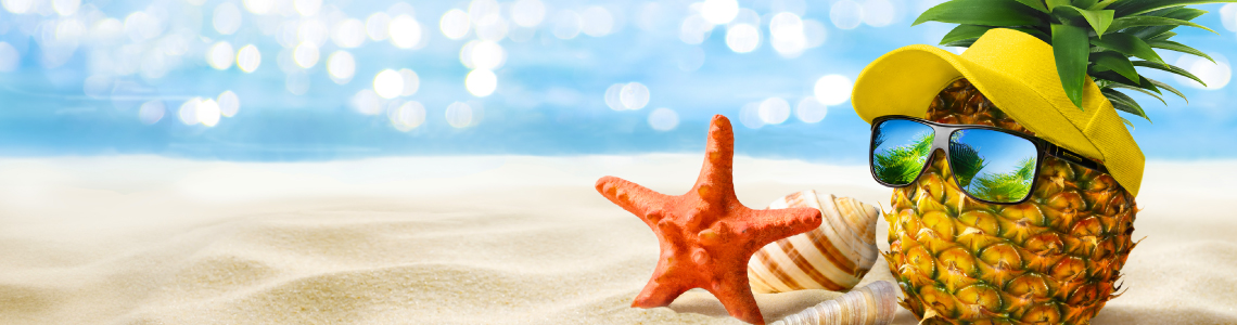 Pineapple with sunglasses and starfish enjoying a sunny beach day.